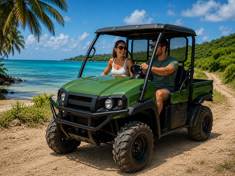 Couple driving a green 2-passenger Kawasaki Mule UTV in Vieques